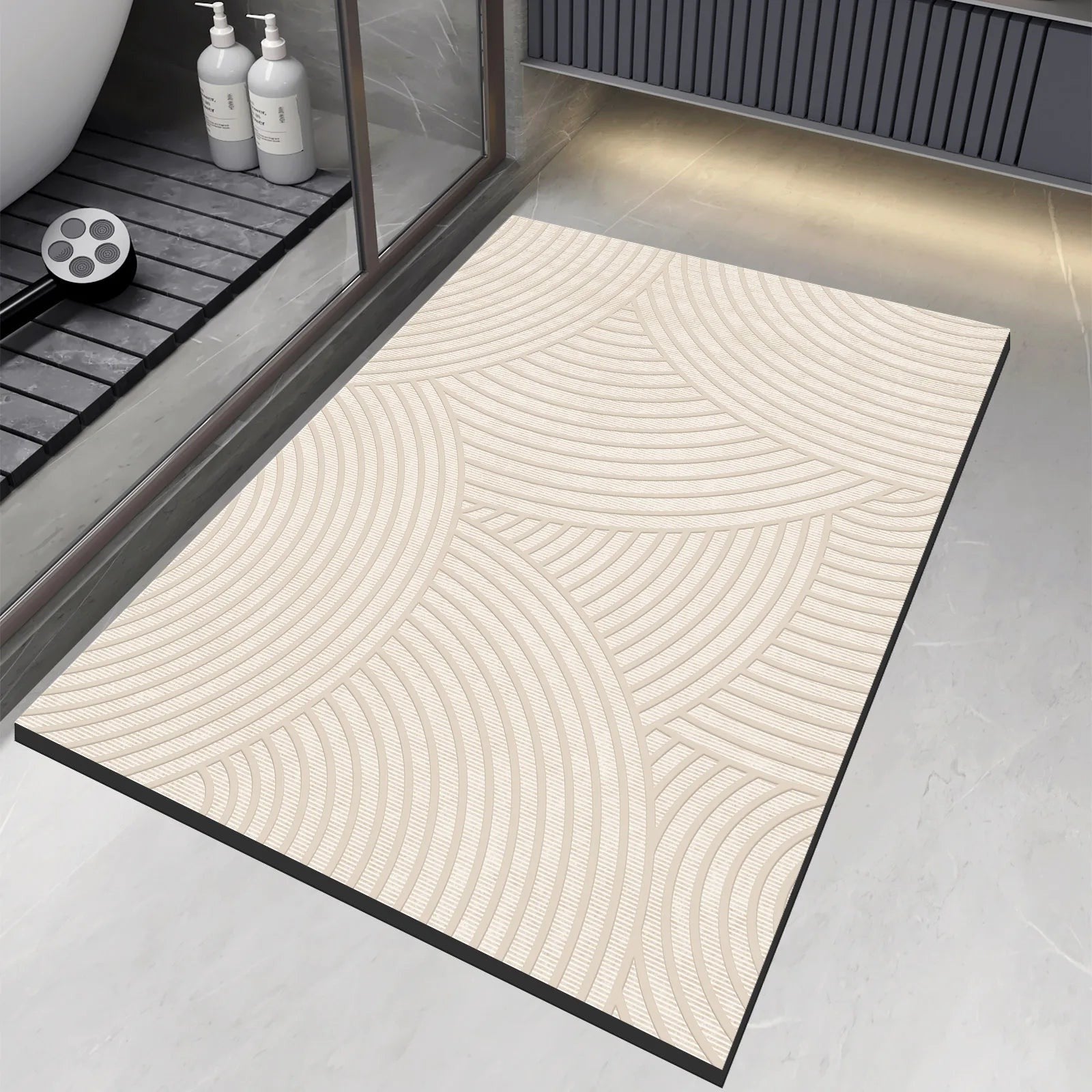 Ordenza Home beige suede bath mat with geometric arch pattern, featuring an anti-slip base for bathroom use.