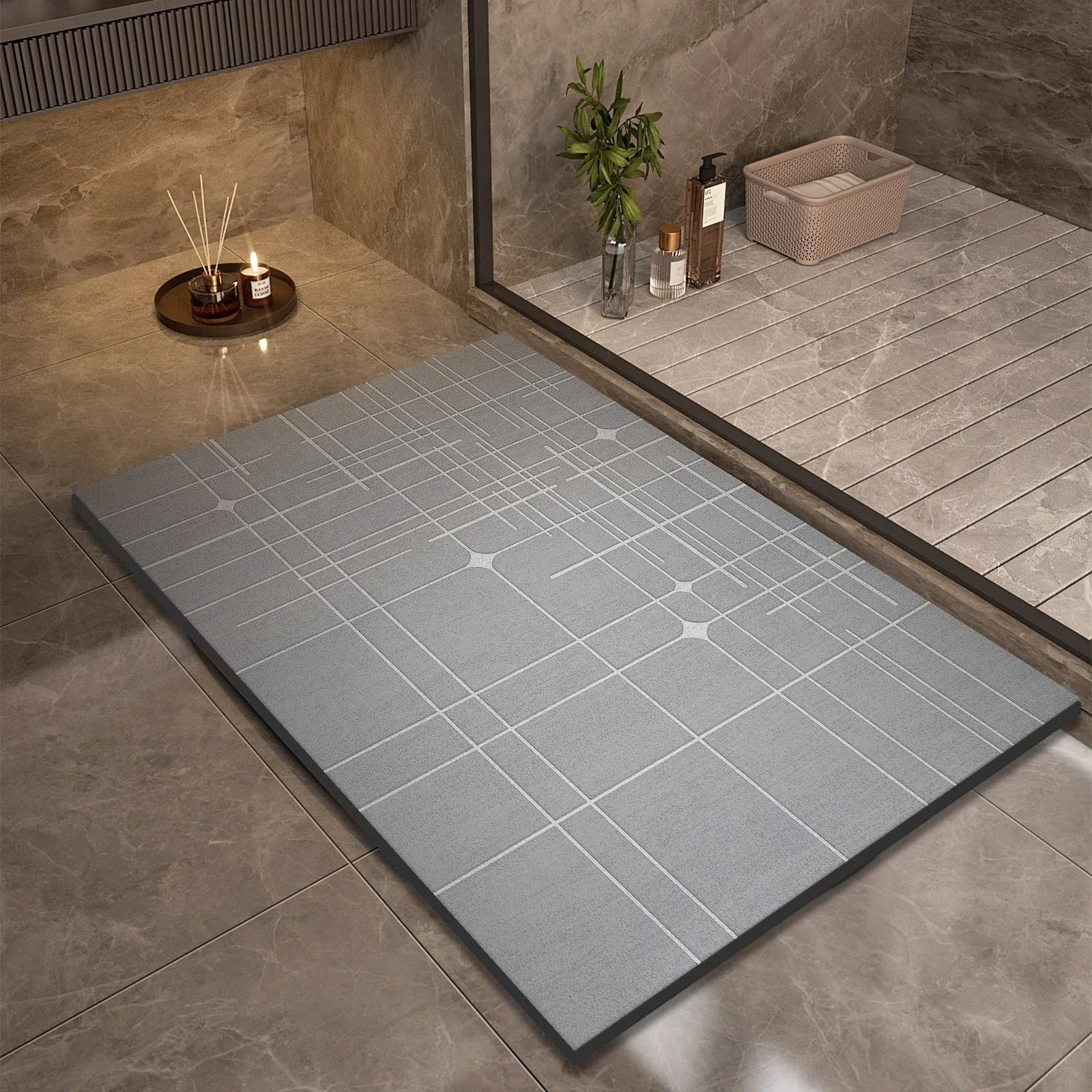 Ordenza Home grey suede bathroom mat with a geometric grid pattern, featuring an anti-slip base for quick drying.