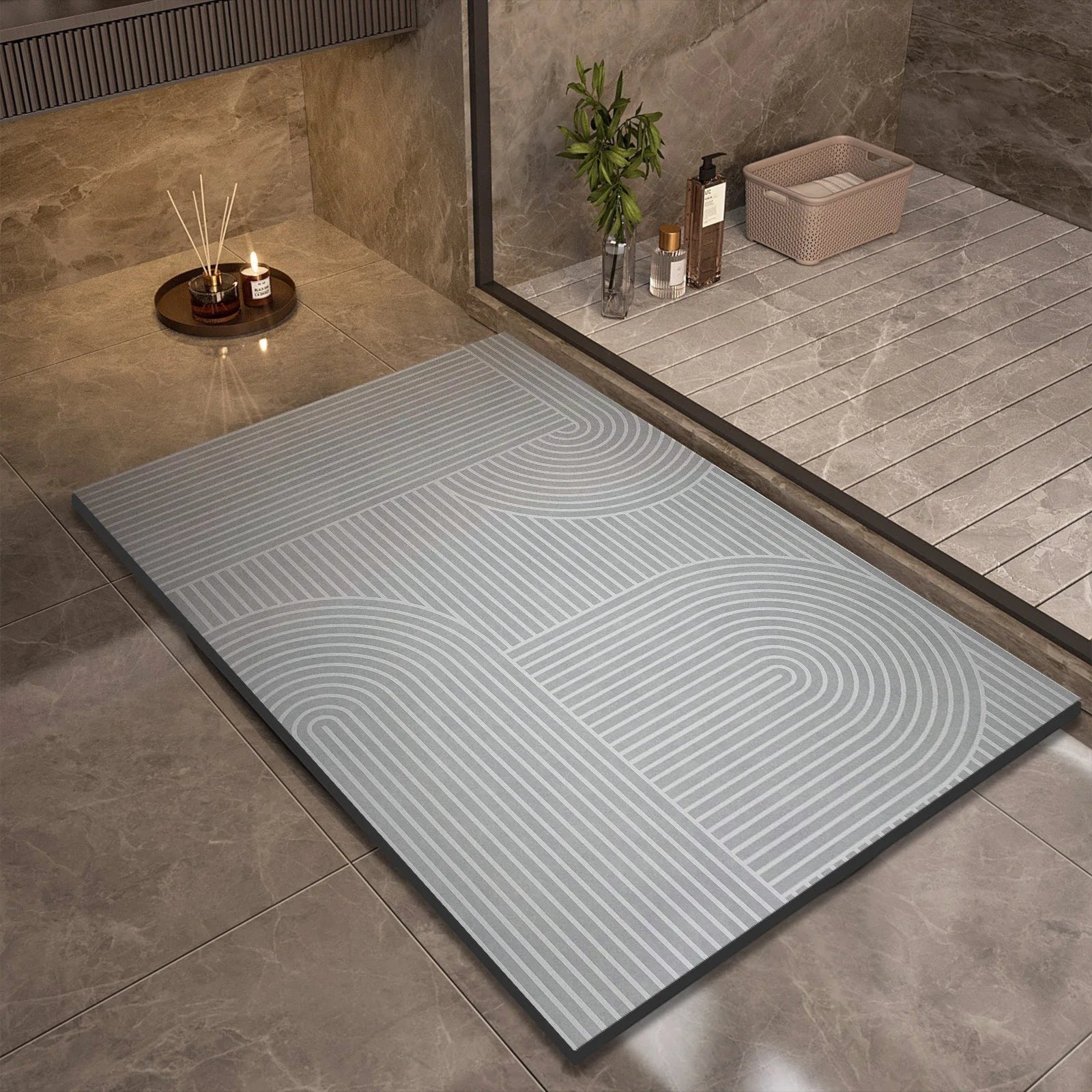 Ordenza Home grey suede bath mat with geometric line pattern on a tiled bathroom floor
